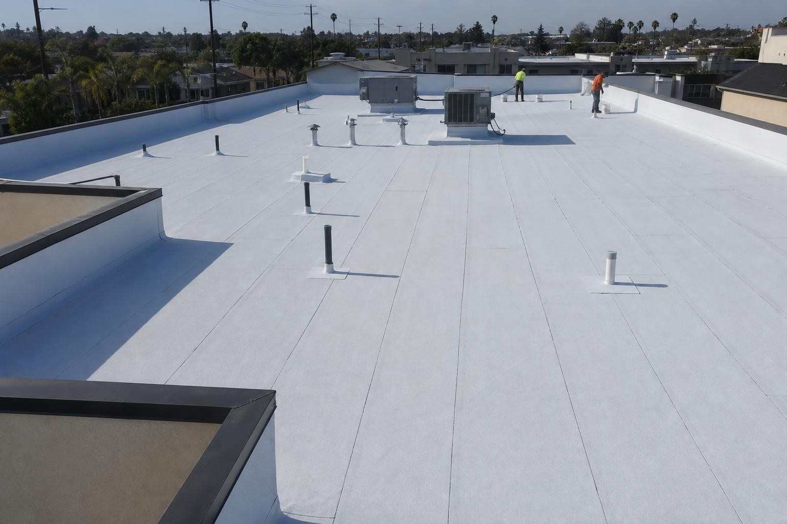 Roofing work underway across a commercial roof, featured on the Pasadena commercial roofing page.