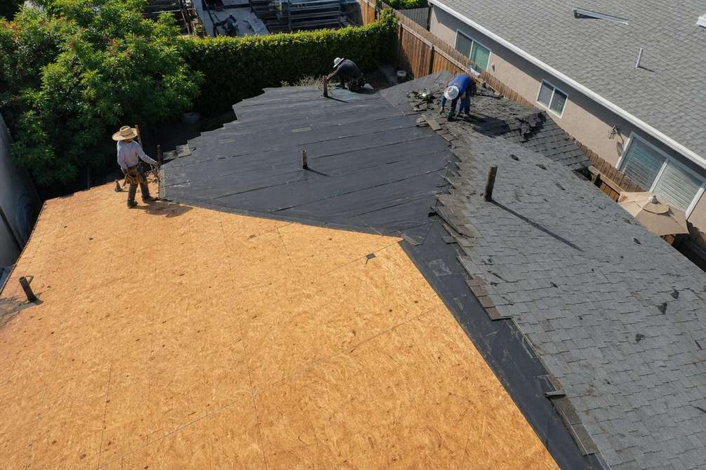An exposed roof deck during a roof replacement, featured on the Pasadena roof replacement page.