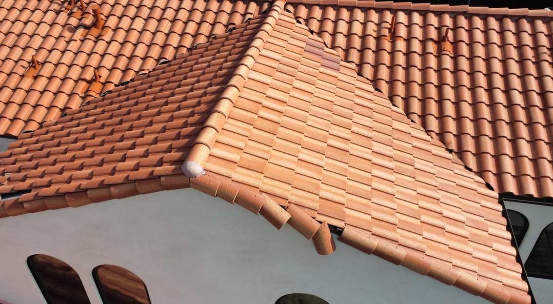 Elevated view of a multi-plane terracotta tile roof, featured on the La Cañada Flintridge roofing page.